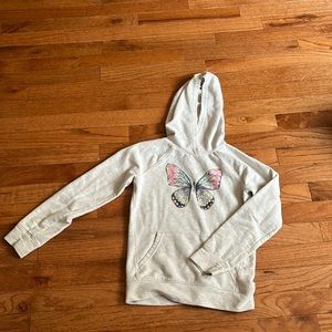 A grey butterfly sweater